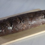 chocolate salami i na peace on a wooden plate